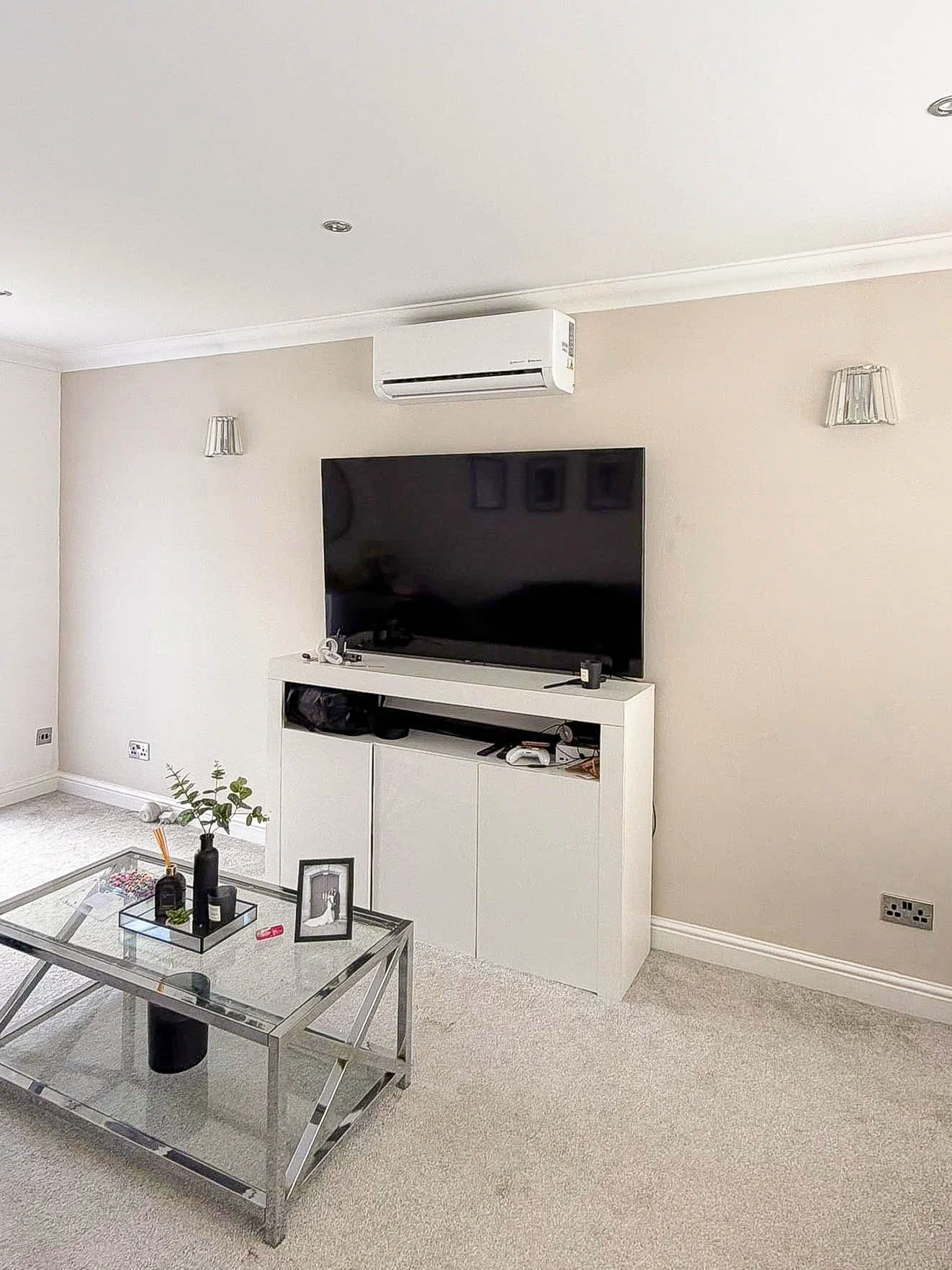 The Cooling Guy team installing a split air conditioning unit in an Essex home
