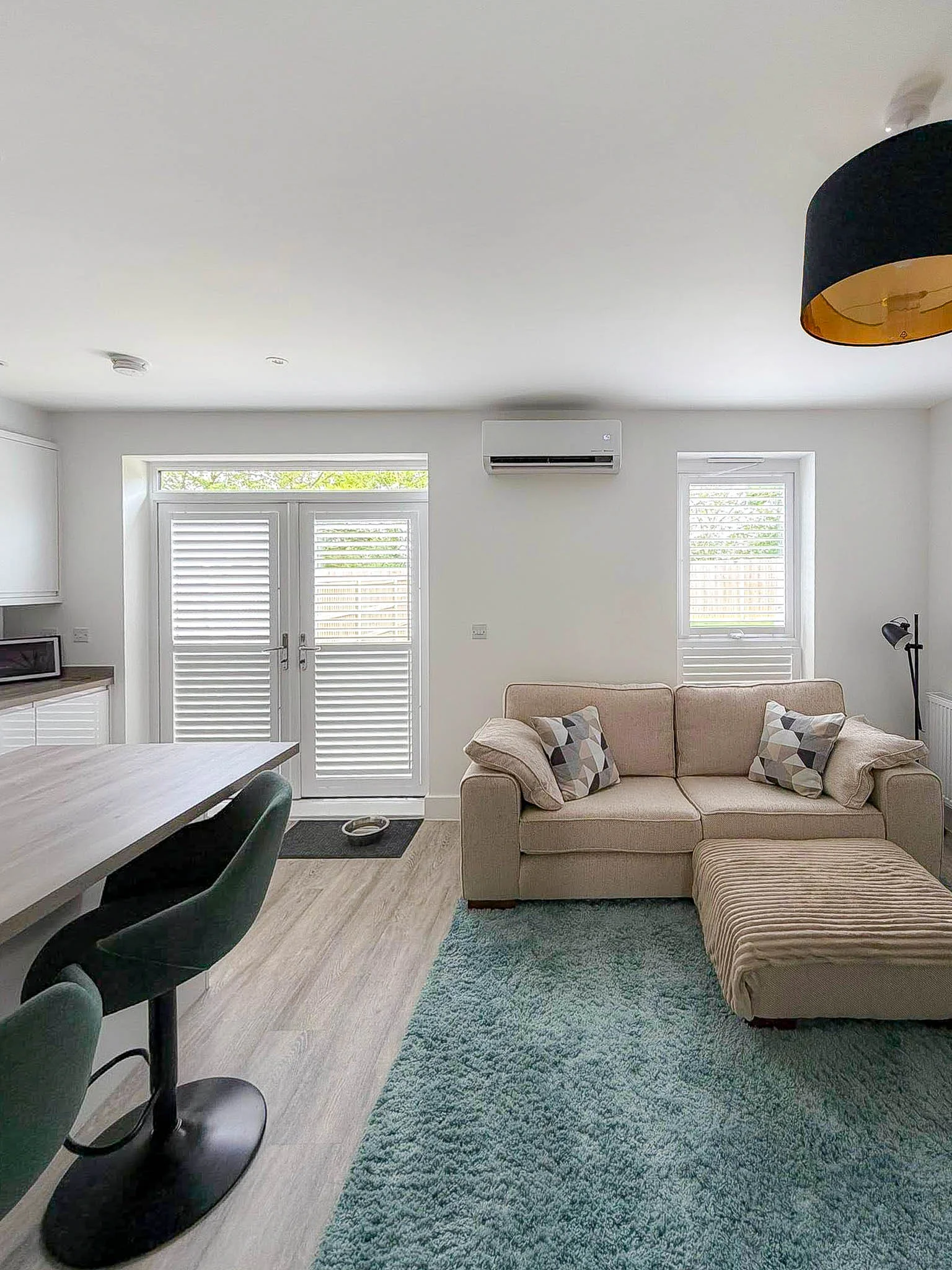 Kitchen & Living Space - High-capacity cooling integrated into an open-plan kitchen and living area. by The Cooling Guy